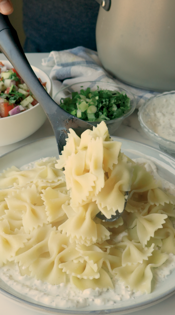 To serve, add a layer of the yogurt mix on the bottom of your plate, followed by your noodles, more yogurt and your hearty meat sauce. 
 Garnish with fresh cilantro and green onions. 